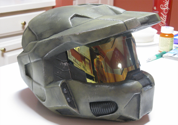 A handmade fiberglass Master Chief helmet. It has custom padding and functional lights.